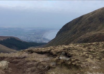 Climbing Slieve Donard, view of Newcastle from the Saddle on Slieve Donard
