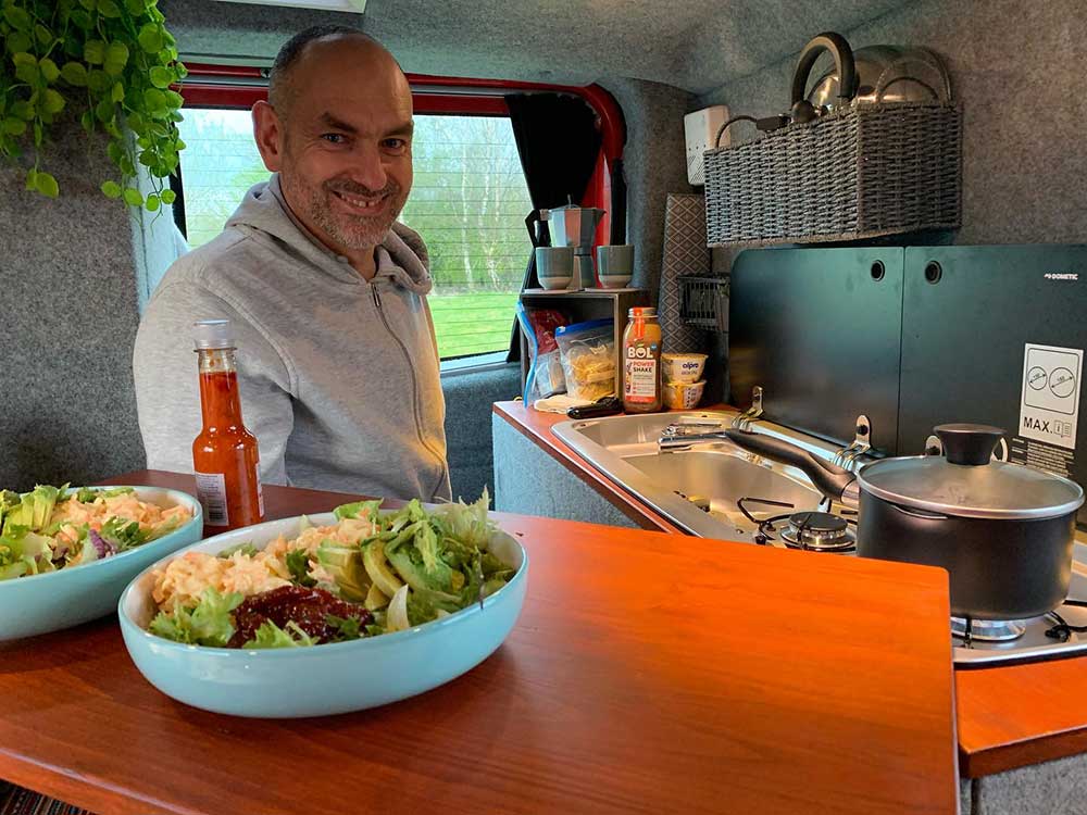 Alan cooking in the camper kitchen Alan cooking in the camper kitchen